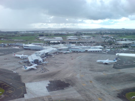 Travelers at Auckland International Airport endure hour-long delays, rushing to gates to catch their flights