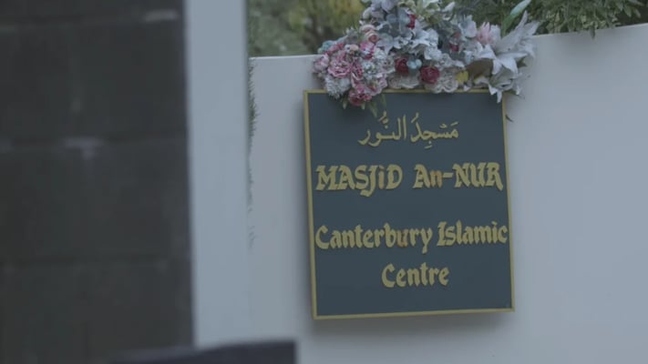 Flowers left at Masjid Annur on the first anniversary in 2020. Photo: RNZ / Logan Church