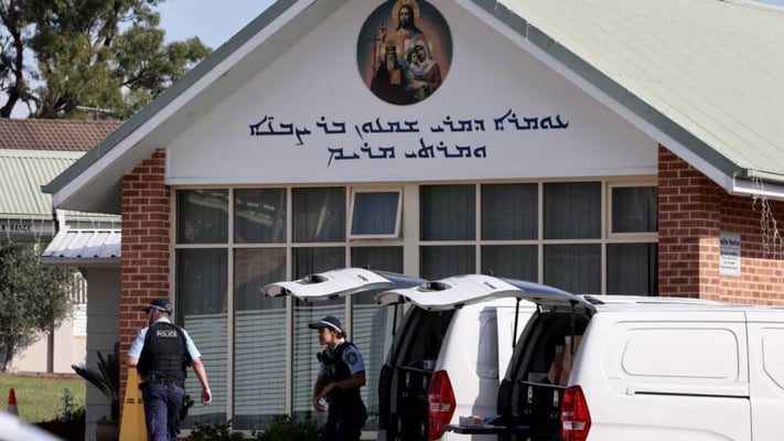 Police officers and their vehicles can be seen outside the Christ the Good Shepherd Church in Sydney's western suburb of Wakeley on 16 April 16, 2024