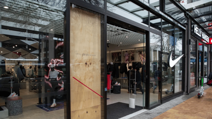 A window is boarded up at a Nike store in Cashel Street Christchurch after a burglary on 14 July