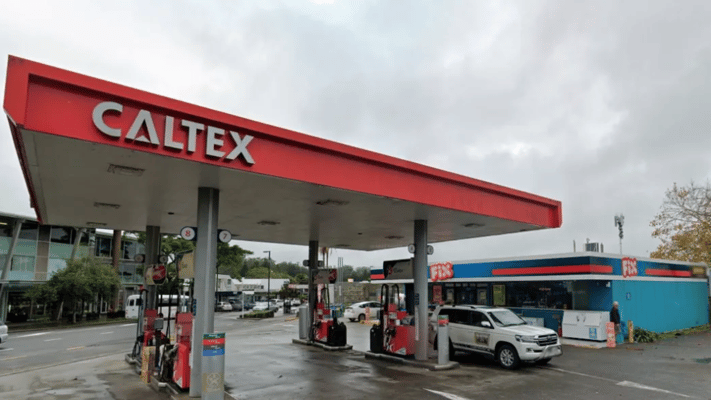 Kerikeri police have arrested a man they say used a gun to rob a service station - then ran away with only sweets and chocolate.