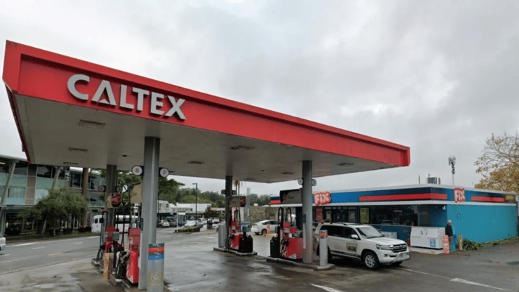 Kerikeri police have arrested a man they say used a gun to rob a service station - then ran away with only sweets and chocolate.