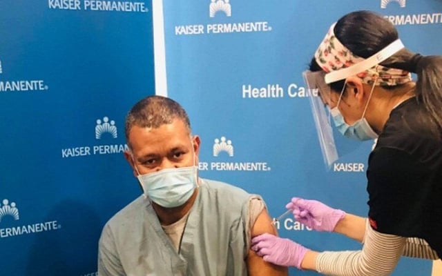 Health worker receives second shot of vaccine
