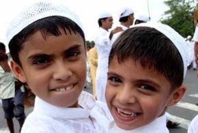 India celebrates Eid, flood dampens spirit in Pakistan