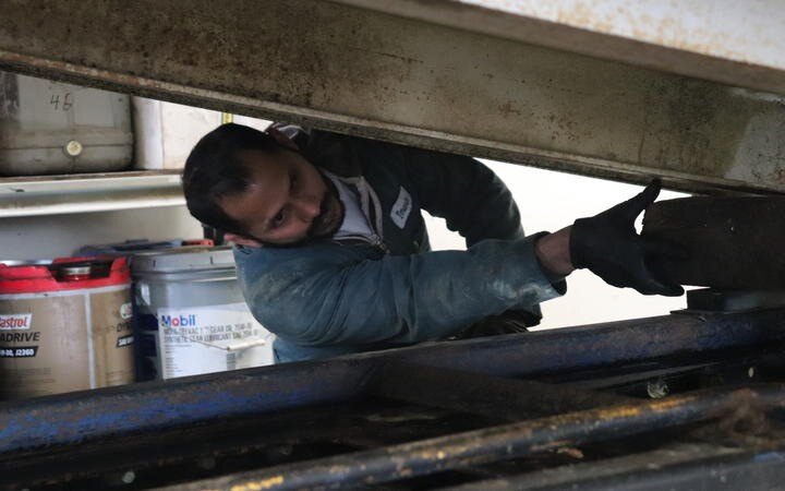 Migrant workers and their families left in limbo over restrictions