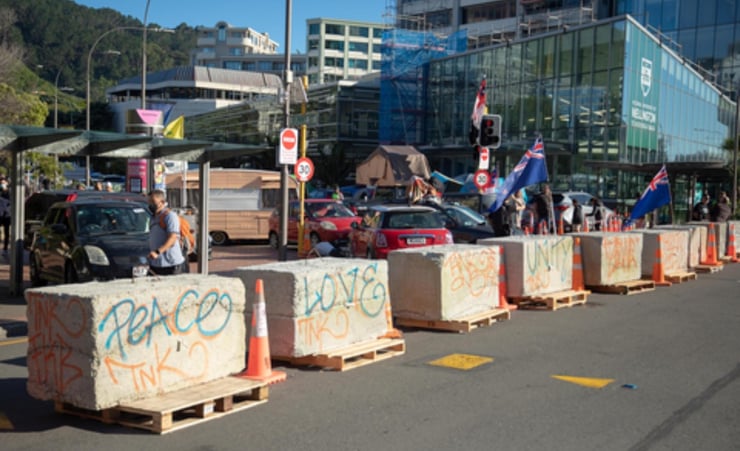 Police and protesters face off near Parliament for 14th day