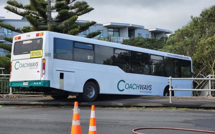 Bus crashes into barrier in Auckland, witnesses say it is dangling off bridge