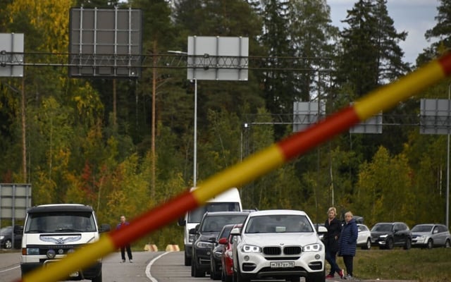 Queues form at Russia's borders after Putin's military mobilisation order prompts men to flee