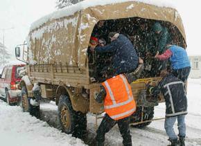 Winter in spring as roads close following snowfall