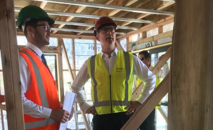 What is in government’s promise for the first major housing project?