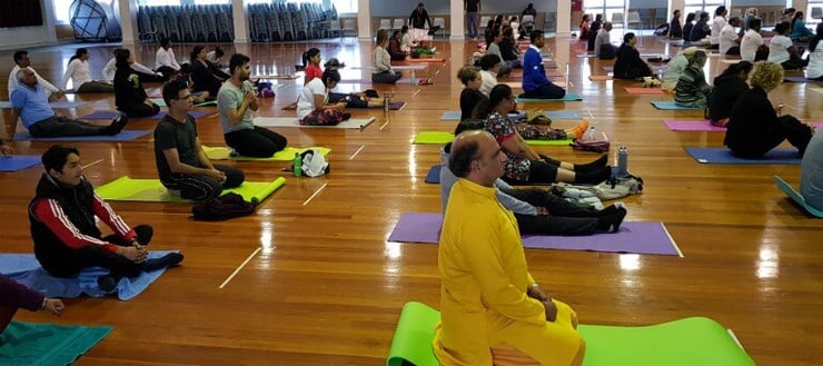 Kiwis roll out mats for International Yoga Day